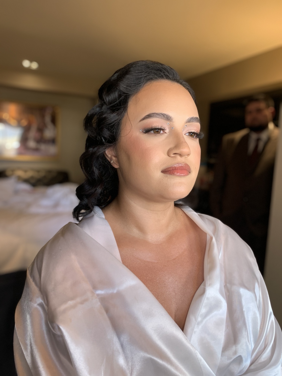 Finished event makeup and styled hair